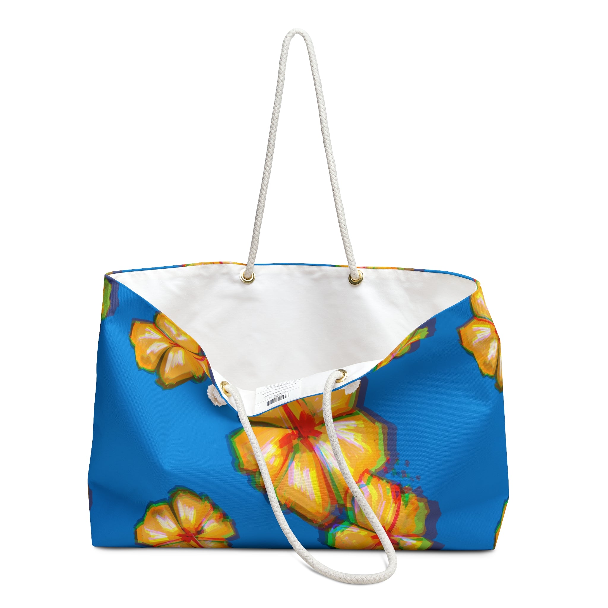 inside view of a colorful beach bag with colorful floral design on a blue background