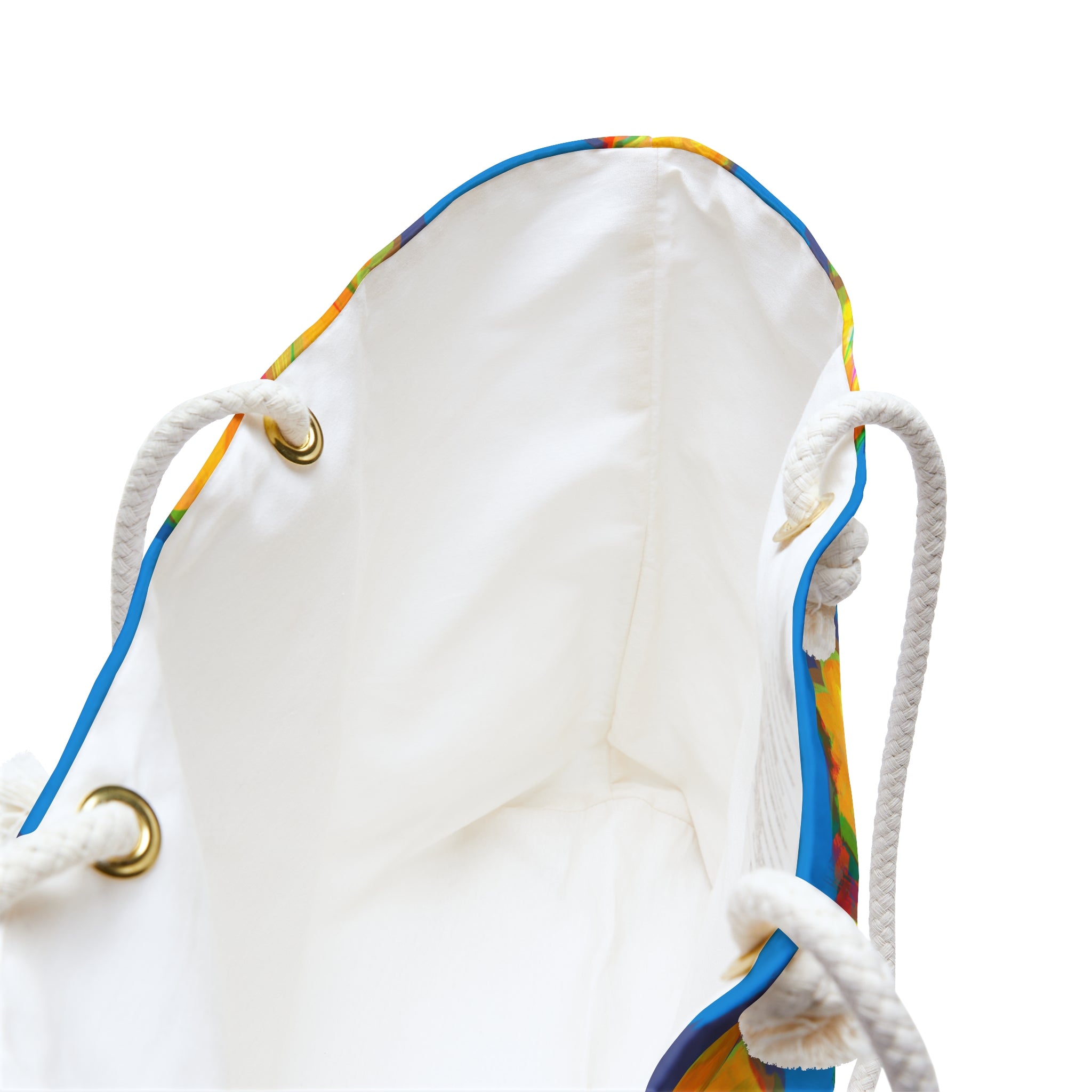view of inside liner of a colorful beach bag with colorful floral design on a blue background
