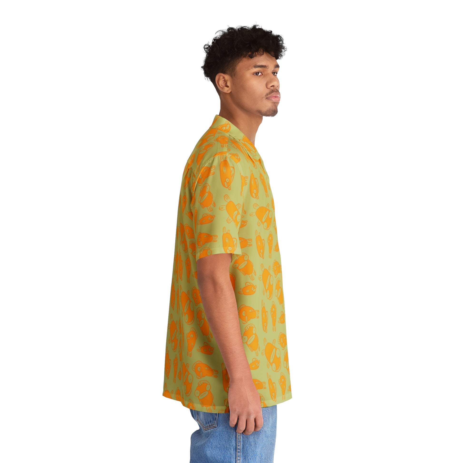 side view of hawaiian man wearing 90s nostalgic print with funky fish character design in orange linework on sage green button up aloha shirt 