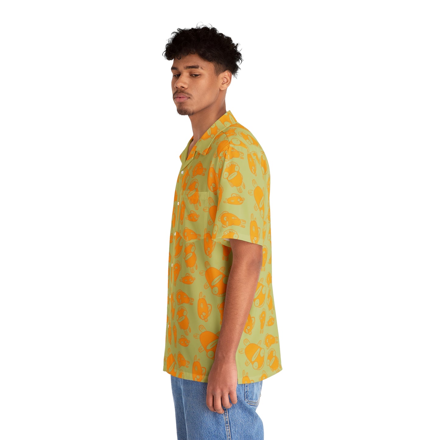 side view of hawaiian man wearing 90s nostalgic print with funky fish character design in orange linework on sage green button up aloha shirt 