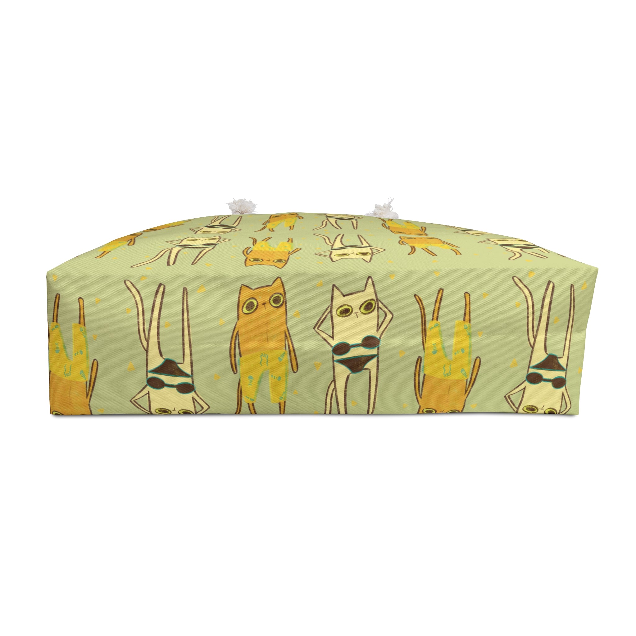 bottom view of an oversized green beach bag featuring an all-over print of cats in swimsuits in funky 90s style illustration