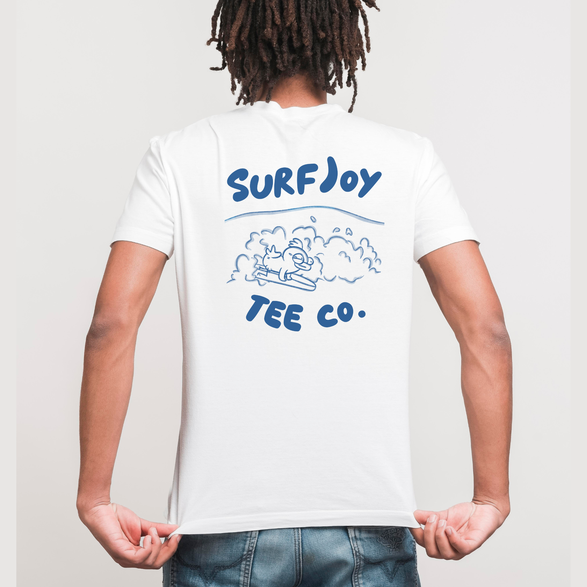 man wearing a funny surfer t-shirt with a surfing chicken design next to text that says 'surfjoy tee co.'