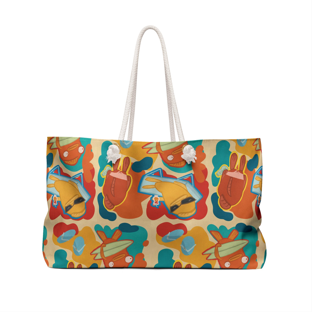 back view of an oversized beach bag with a groovy all over print of cute fish characters on the beach