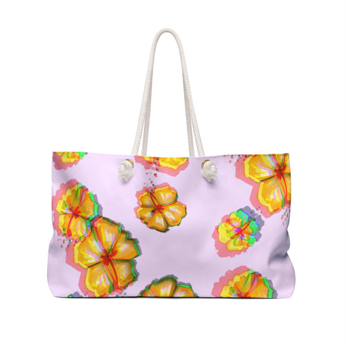 back view of a light purple beach bag with a colorful hibiscus flower pattern