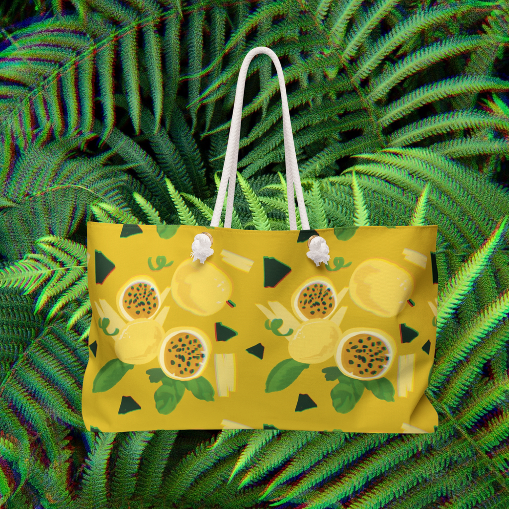 Yellow beach bag with a hawaiian lilikoi pattern on a green leaf background