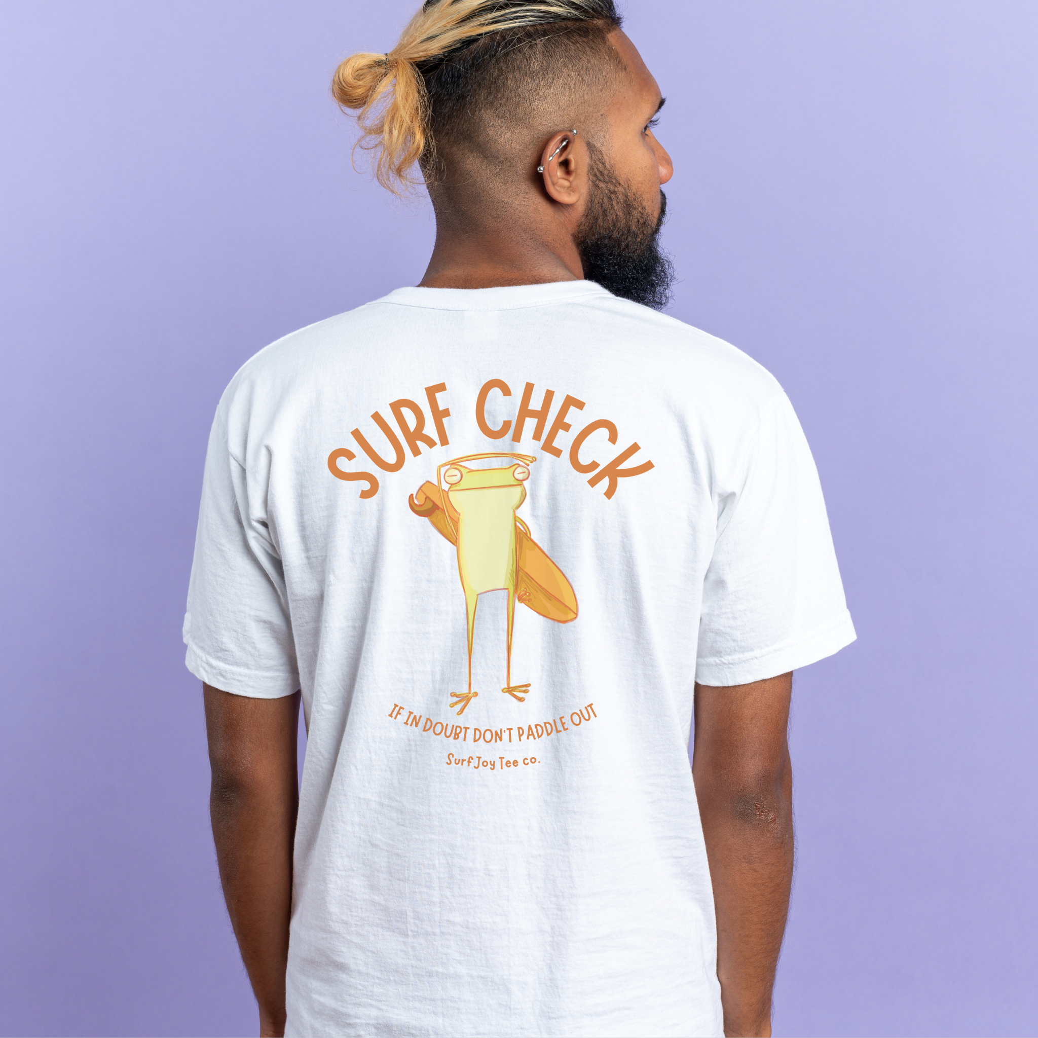 man wearing surfjoy surf check t-shirt over a purple background