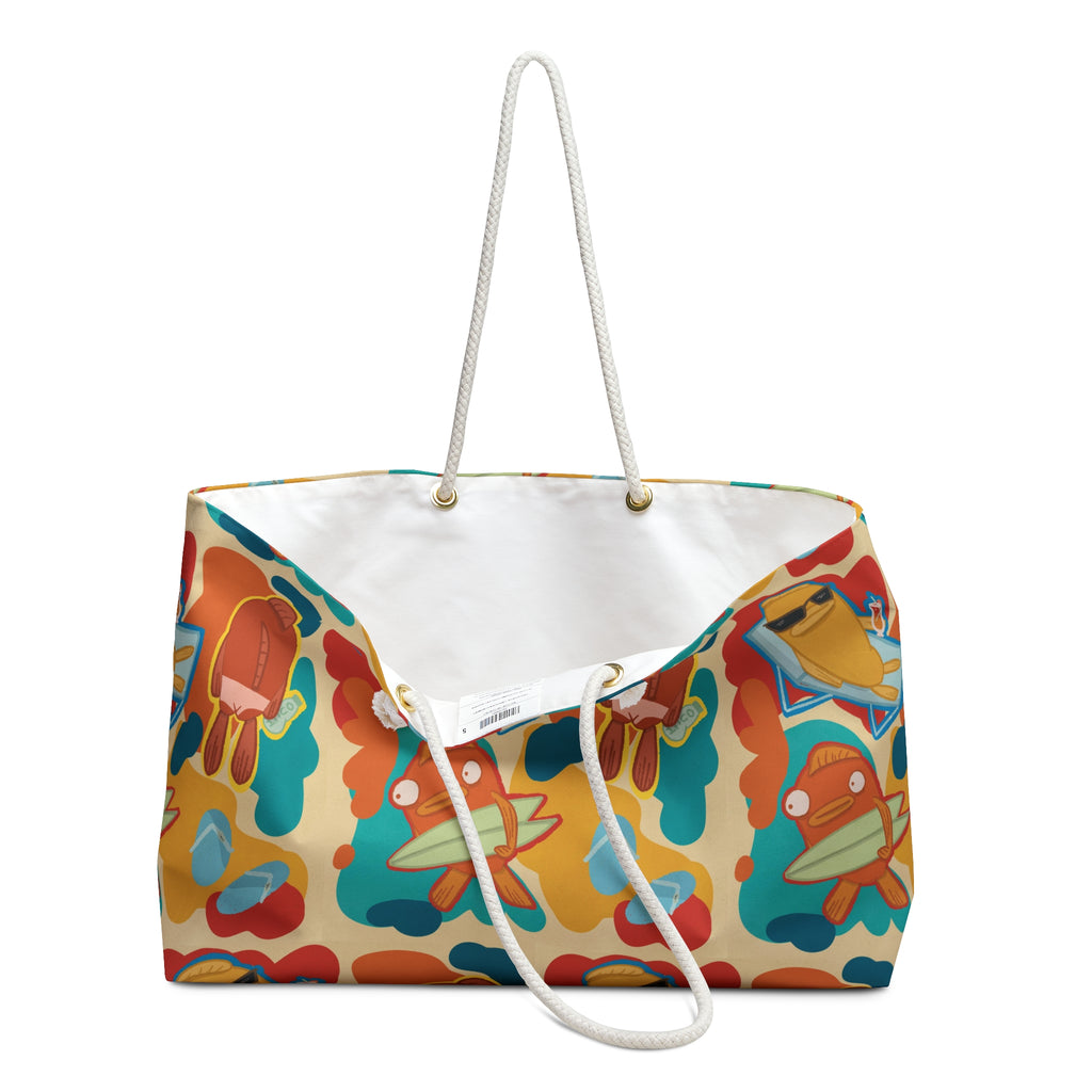 open oversized beach bag with a groovy all over print of cute fish characters on the beach