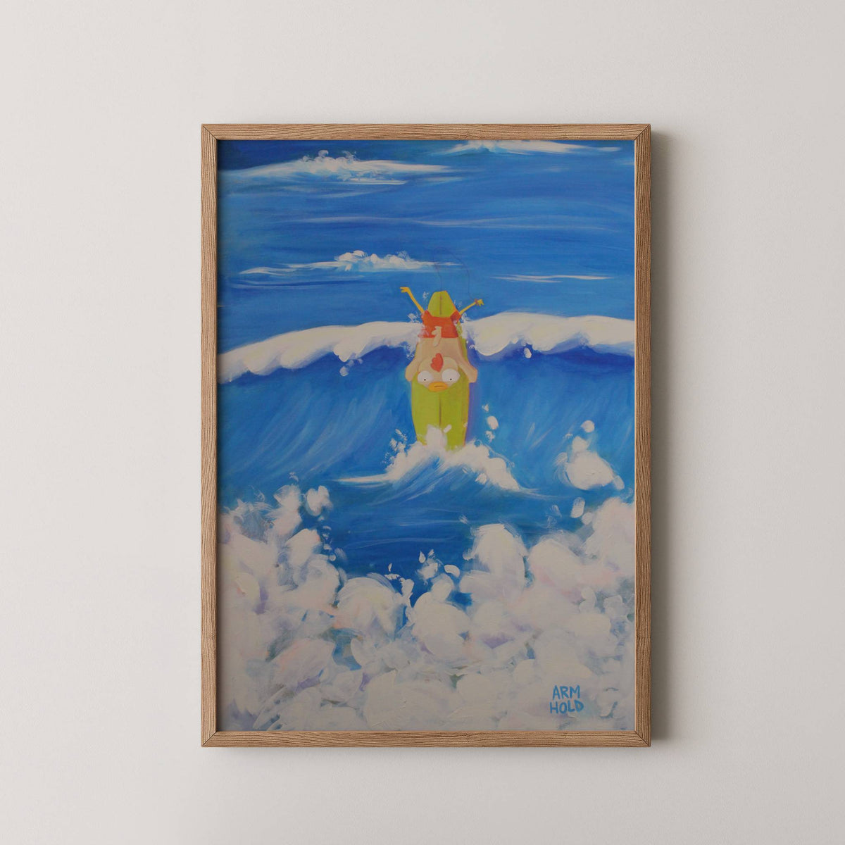 A framed painting of a surfing chicken character wiping out on an ocean wave,  hung on a light beige wall.