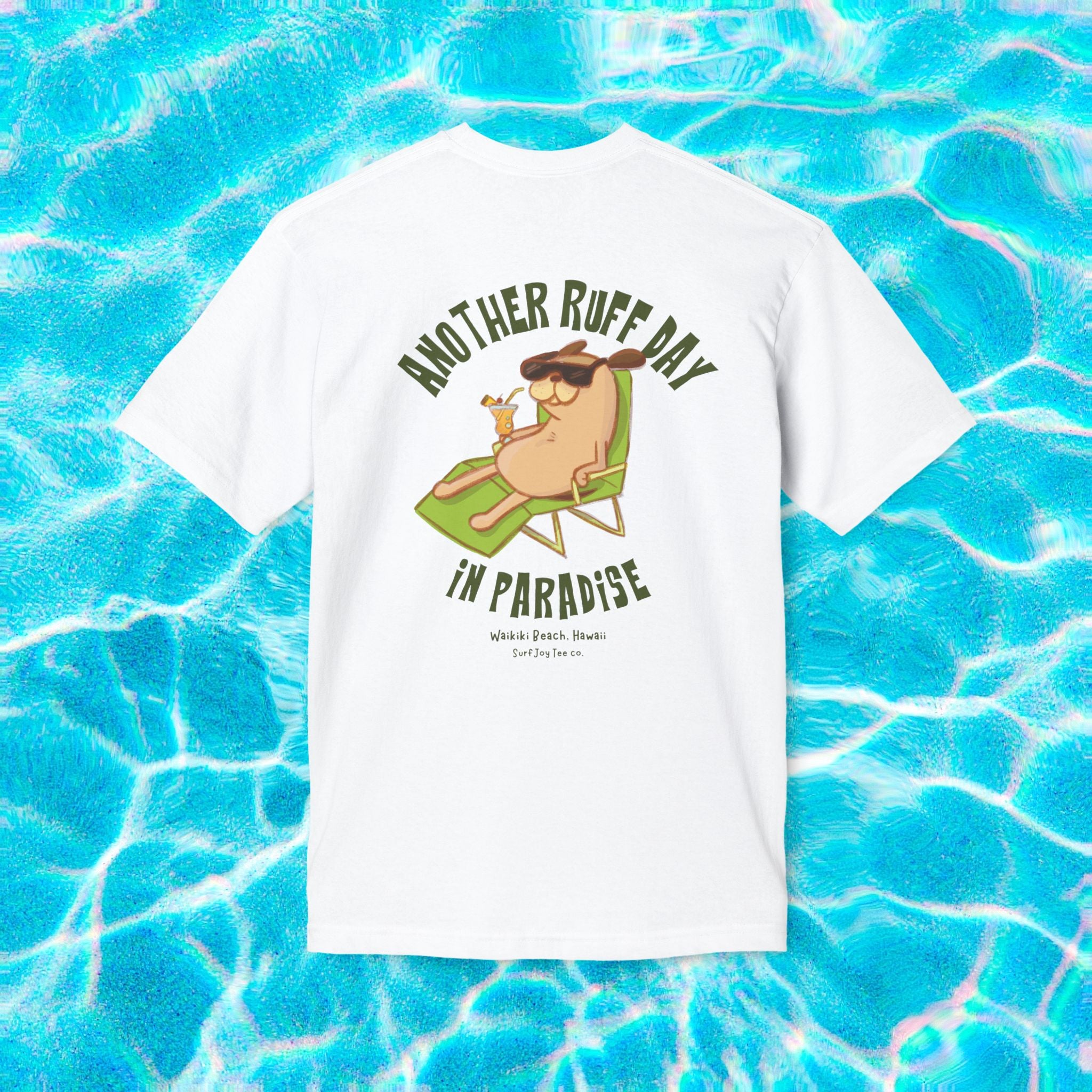 a waikiki beach t-shirt featuring a dog in a beach chair with text thats says 'another ruff day in paradise'
